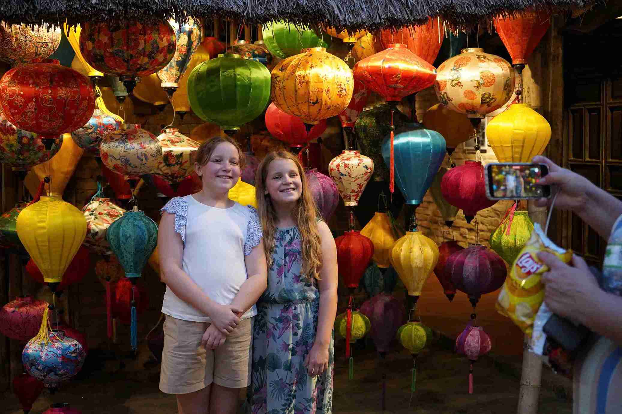 Foreign tourists eagerly check in to the old Tet space. Photo: Huu Long