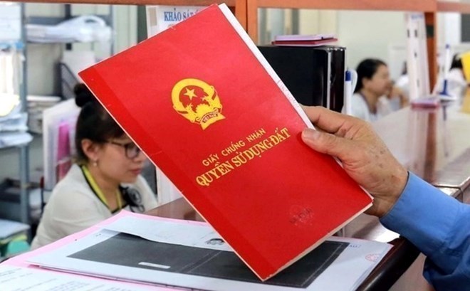 Land registration office issues first-time red book. Photo: Phan Anh