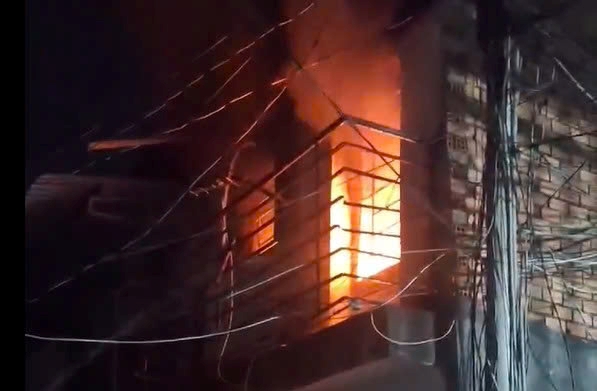 Scene of a house fire at night in Ho Chi Minh City. Photo: Reader provided