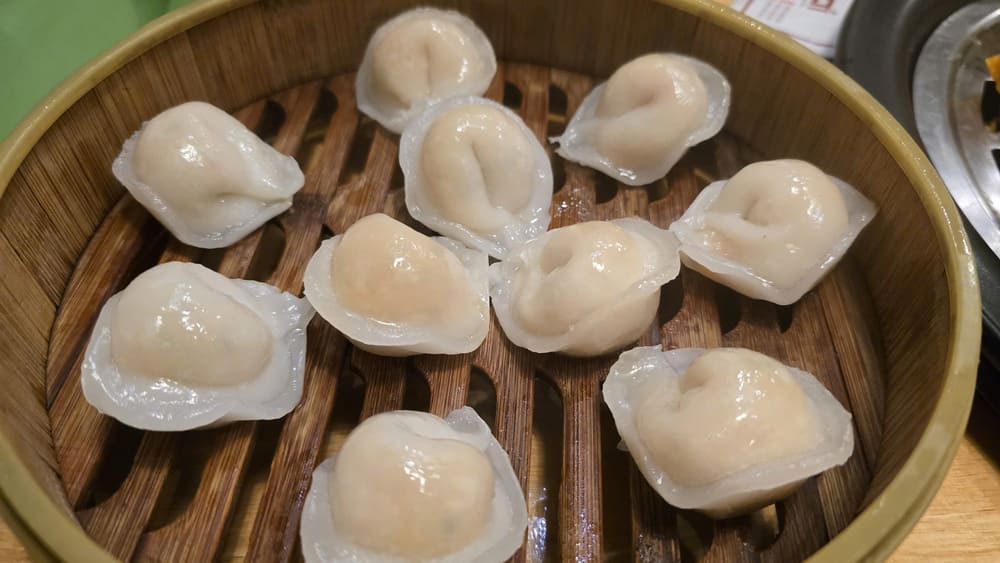Making hot fresh shrimp scallop dumplings to relieve boredom after Tet. Photo: Tuan Dat