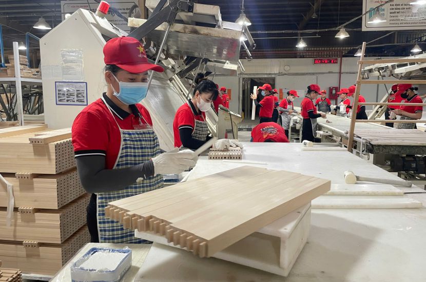 Asia Italy Door Industry Co., Ltd. is looking for more orders, welcoming workers back to prepare for production after Tet. Photo: Dinh Trong