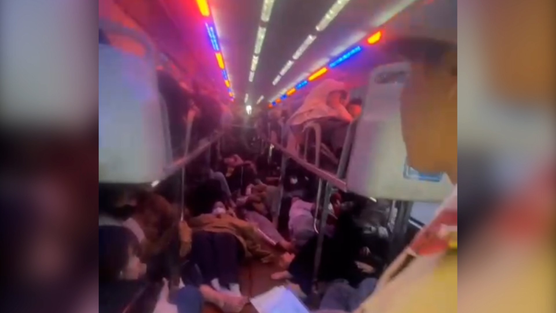 Images inside a 21-seater passenger car crammed with up to 79 people