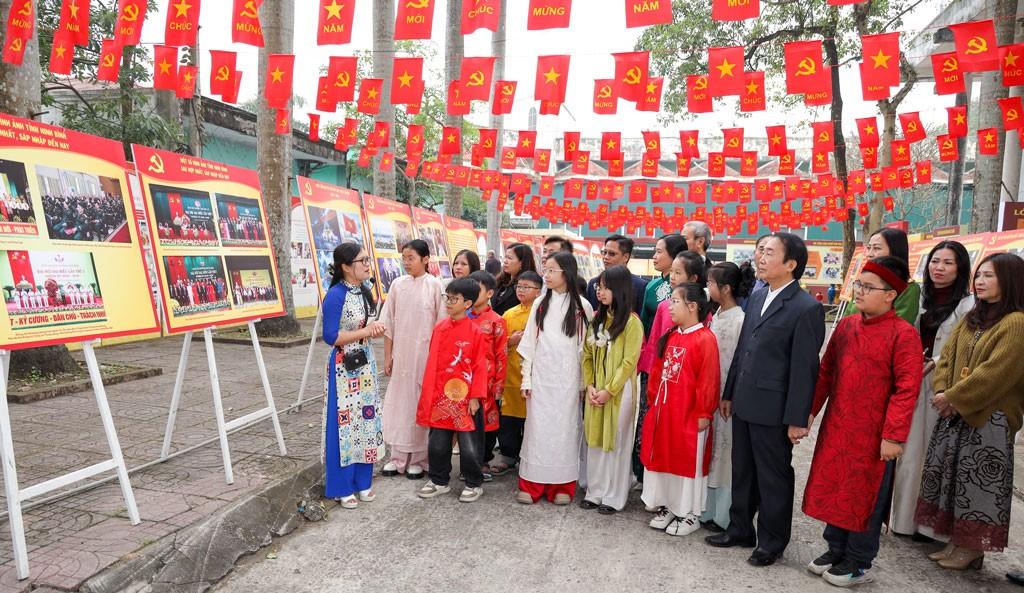Delegates and students visit the exhibition space. Photo: Dieu Anh