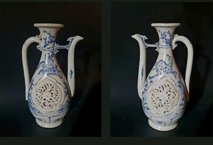 Bình tì bà gốm hoa lam, chạm lọng, thời Lê sơ, thế kỷ XV, kích thước 22,5x12cm.  Ảnh: Nguyễn Văn Dòng cung cấp