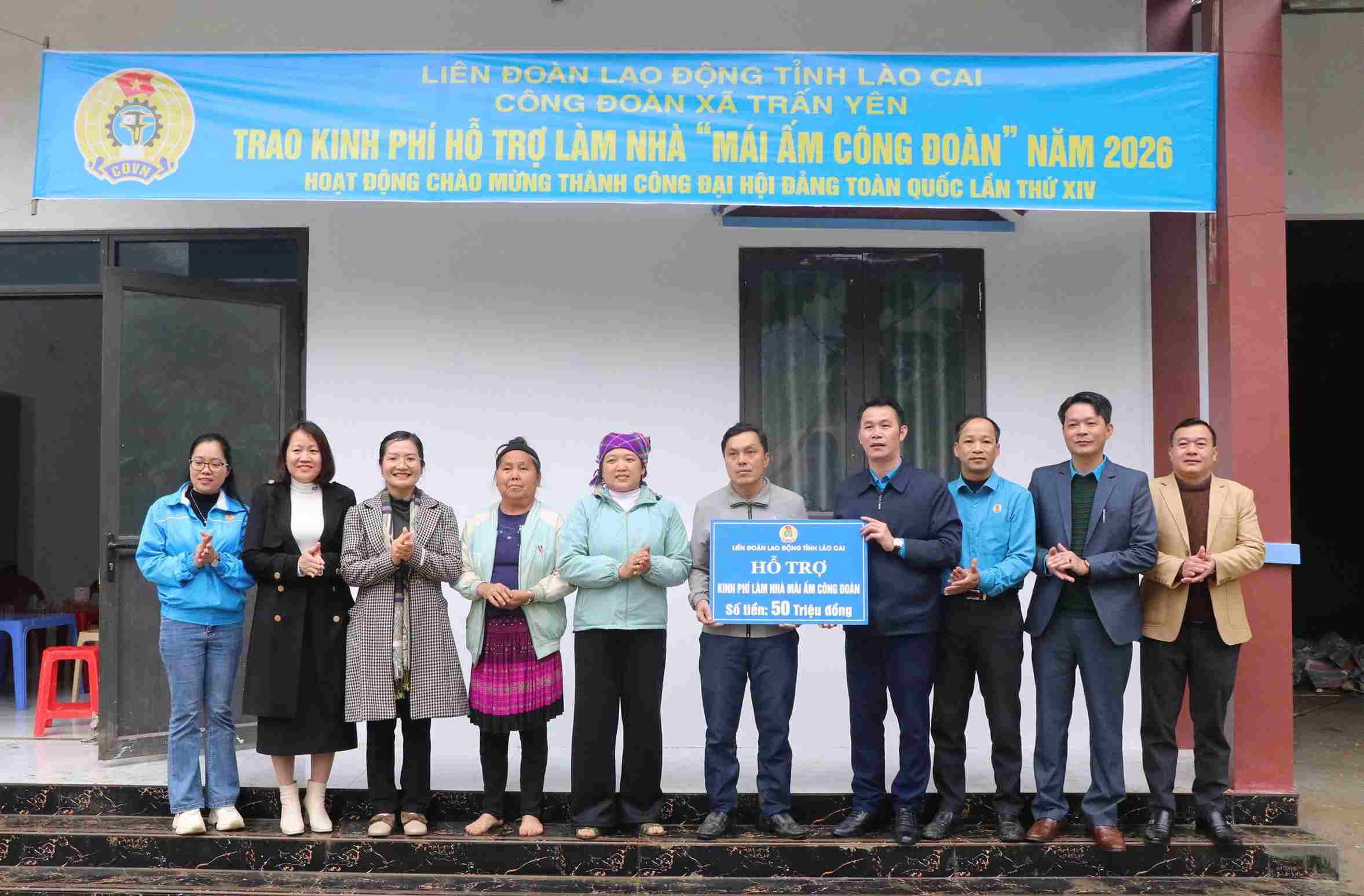 Union member Sung A Chau receives a trade union shelter house. Photo: Bao Nguyen