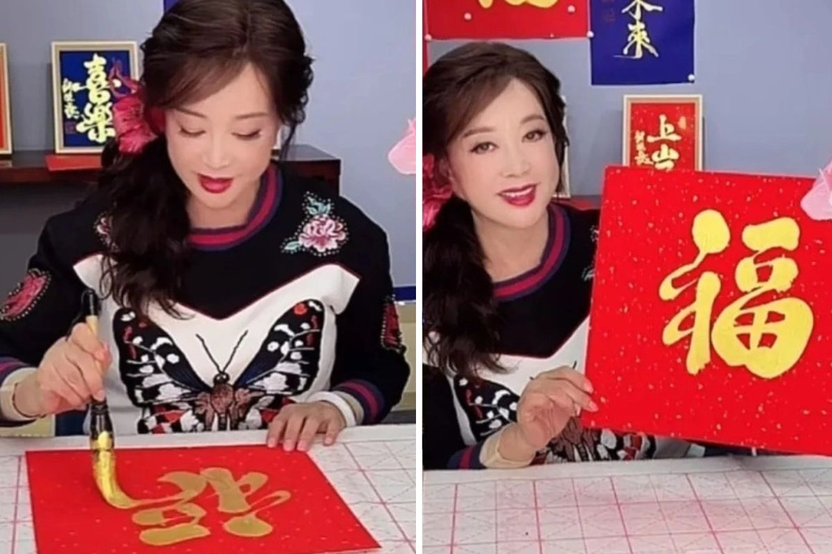 Lưu Hiểu Khánh tự tay viết chữ thư pháp bán trong livestream. Ảnh: cắt từ video