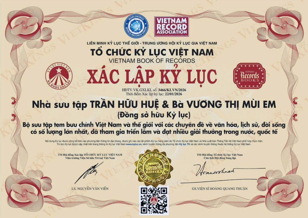 Bản xác nhận kỷ lục Việt Nam cho vợ chồng ông Trần Hữu Huệ và Vương Thị Mùi Em. Ảnh: Văn Thu