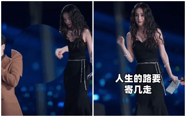 Thẩm Đằng từng hứa đỡ Dương Mịch xuống bậc thang sân khấu nhưng ... quên mất lời. Ảnh cắt từ video.