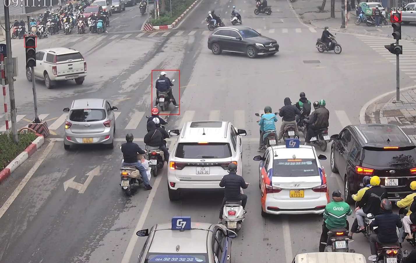 Motorbikes running red lights are recorded by AI cameras for traffic tickets. Photo: Police provided