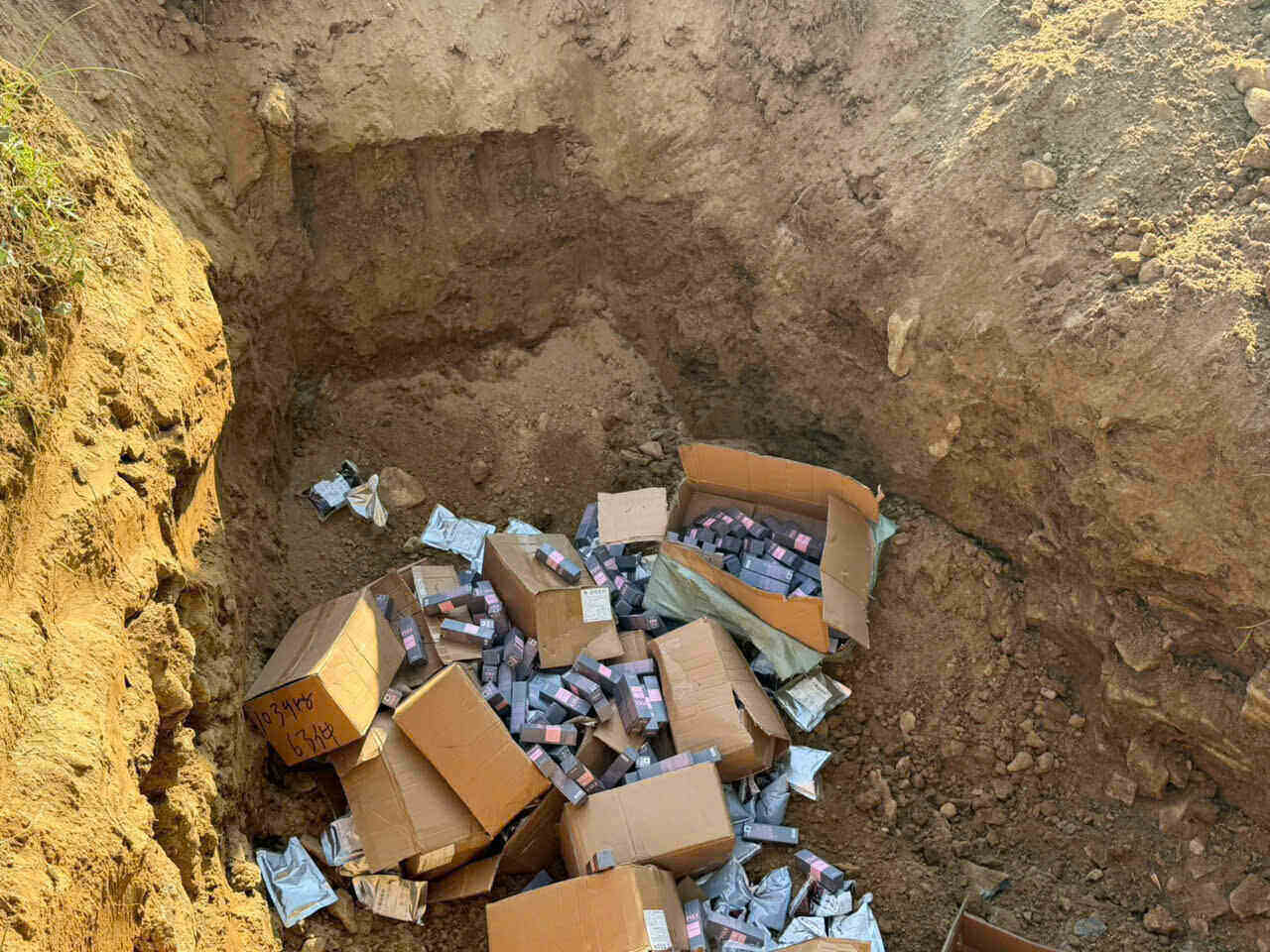 Dak Lak provincial authorities destroy a shipment of goods of unknown origin. Photo: Bao Trung