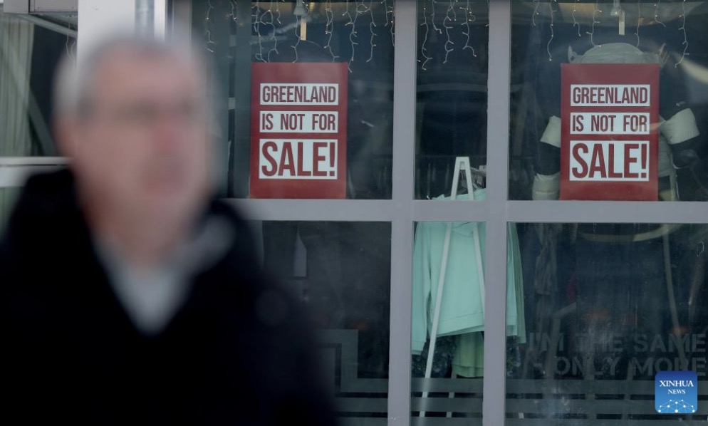 Two posters together with the words "Greenland not for sale" on a window in Nuuk, Greenland, an autonomous territory of Denmark. Photo: Xinhua