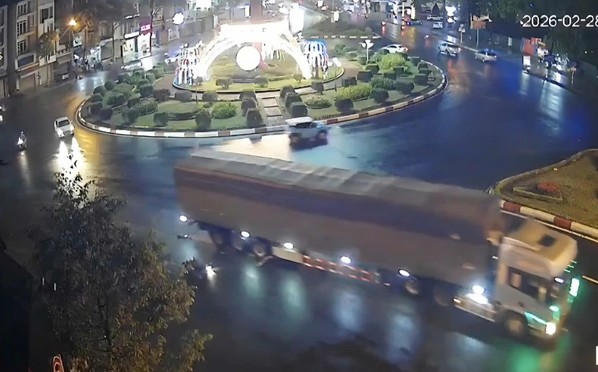 Scene of the collision between a container truck and a motorbike at night. Photo: Police provided