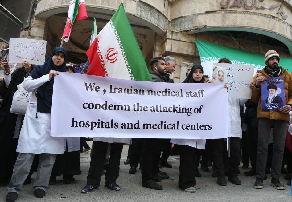 Medical staff protest in front of a damaged hospital in the attack by the US and Israel, in Tehran, Iran, March 7, 2026. Photo: Xinhua