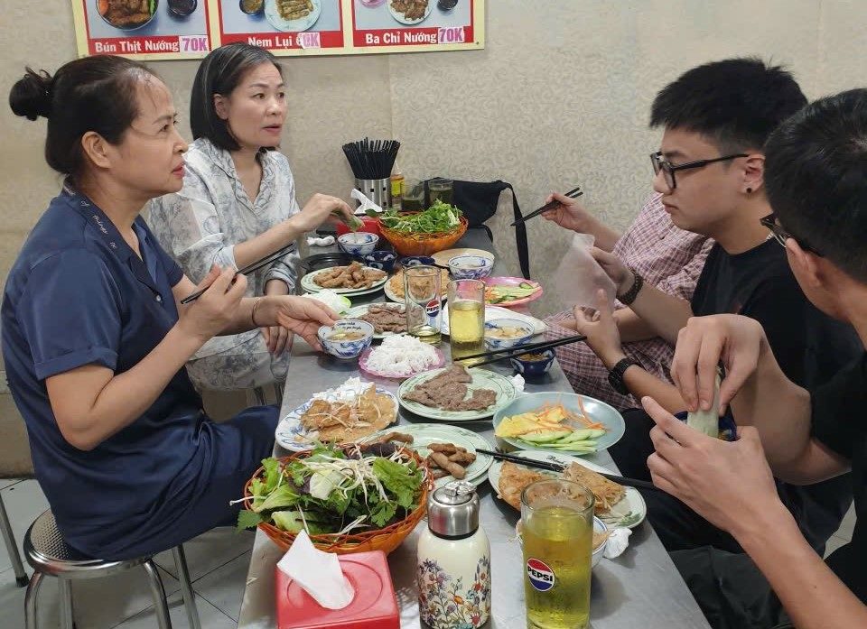 Customers enjoy Quang Ngai banh xeo at Chinh Tham restaurant located at 38 Yen Lang. Photo: Khanh Ly