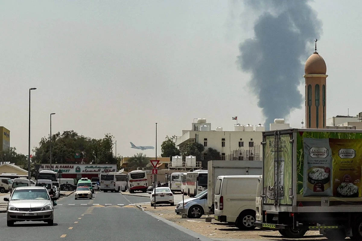 Smoke rises from an attack near Dubai International Airport. Photo: AFP