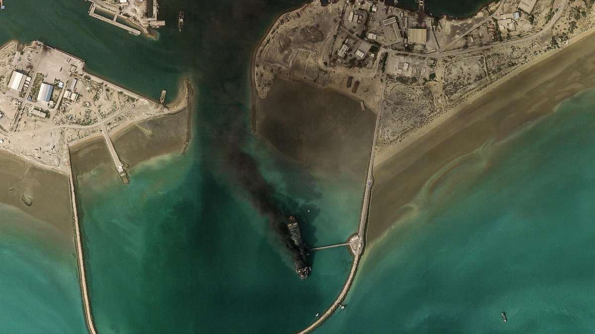 Smoke rises after a ship exploded at Bandar Abbas port in the Strait of Hormuz on March 2, 2026 amid Iran's declaration of blockade of the strait. Photo: Planet Labs PBC/AFP