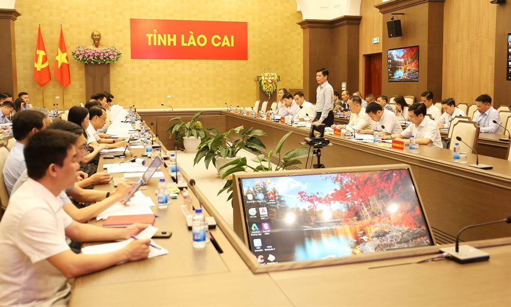 Overview of the working session between Lao Cai Provincial People's Committee and the Working Delegation of the Ministry of Construction. Photo: Van Duc
