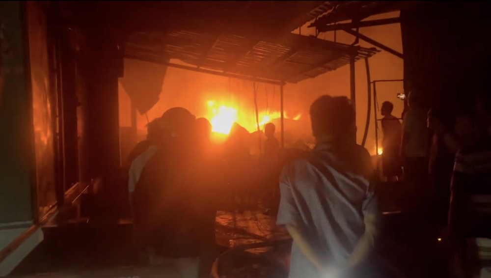 Large fire in riverside houses at night in Ca Mau