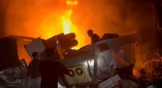 Scene of the fire after an accident between a dump truck and a tractor truck in Ho Chi Minh City