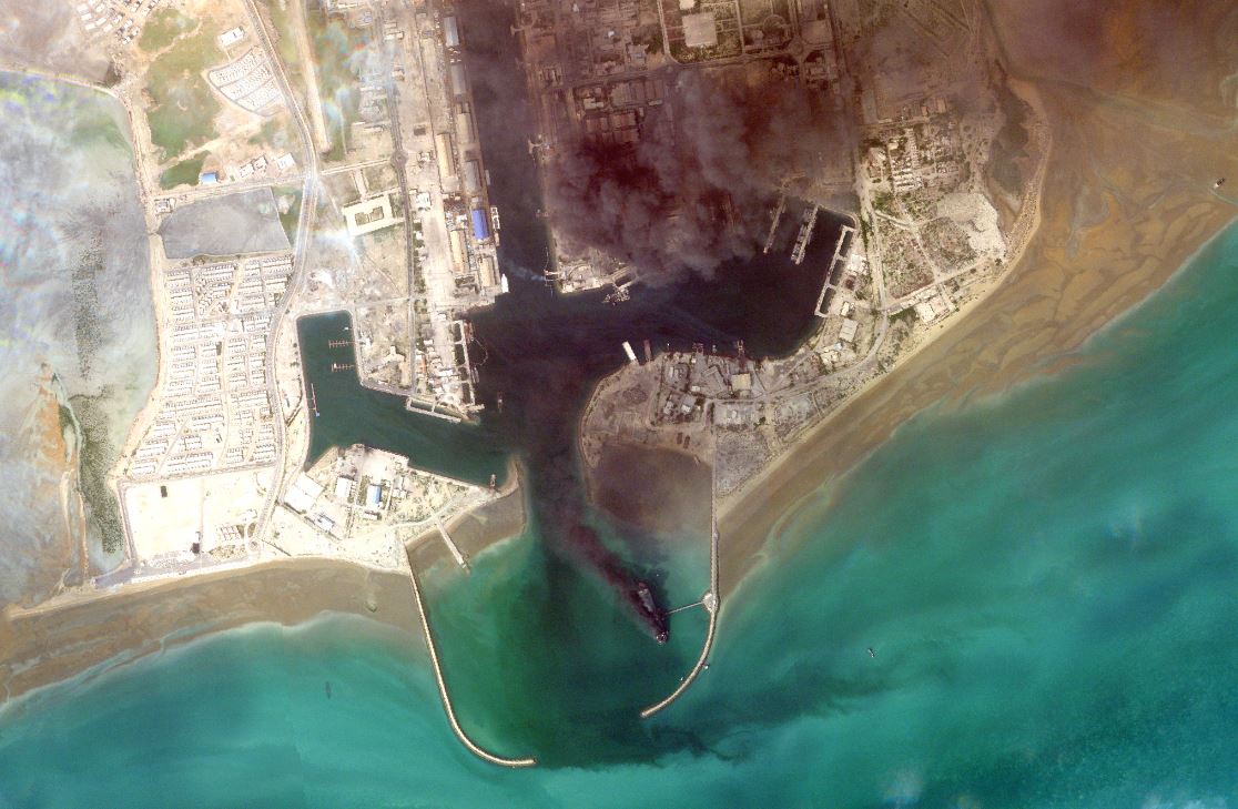 Smoke rises after a ship explodes at Bandar Abbas port in the Strait of Hormuz on March 2, 2026. Photo: Planet Labs