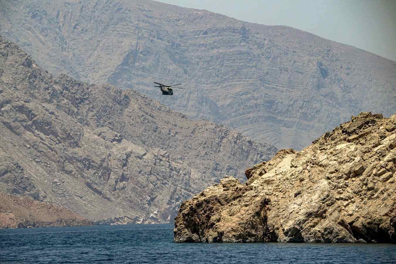 The US may reopen the Strait of Hormuz by force, but this scenario will be a "red line" with Iran. Pictured is an Oman military helicopter patrolling in the Strait of Hormuz off the coast of Khasab in the Musandam Peninsula north of Oman in June 2025. Photo: AFP