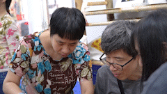 International tourists are excited to make handicraft silk with disabled children.