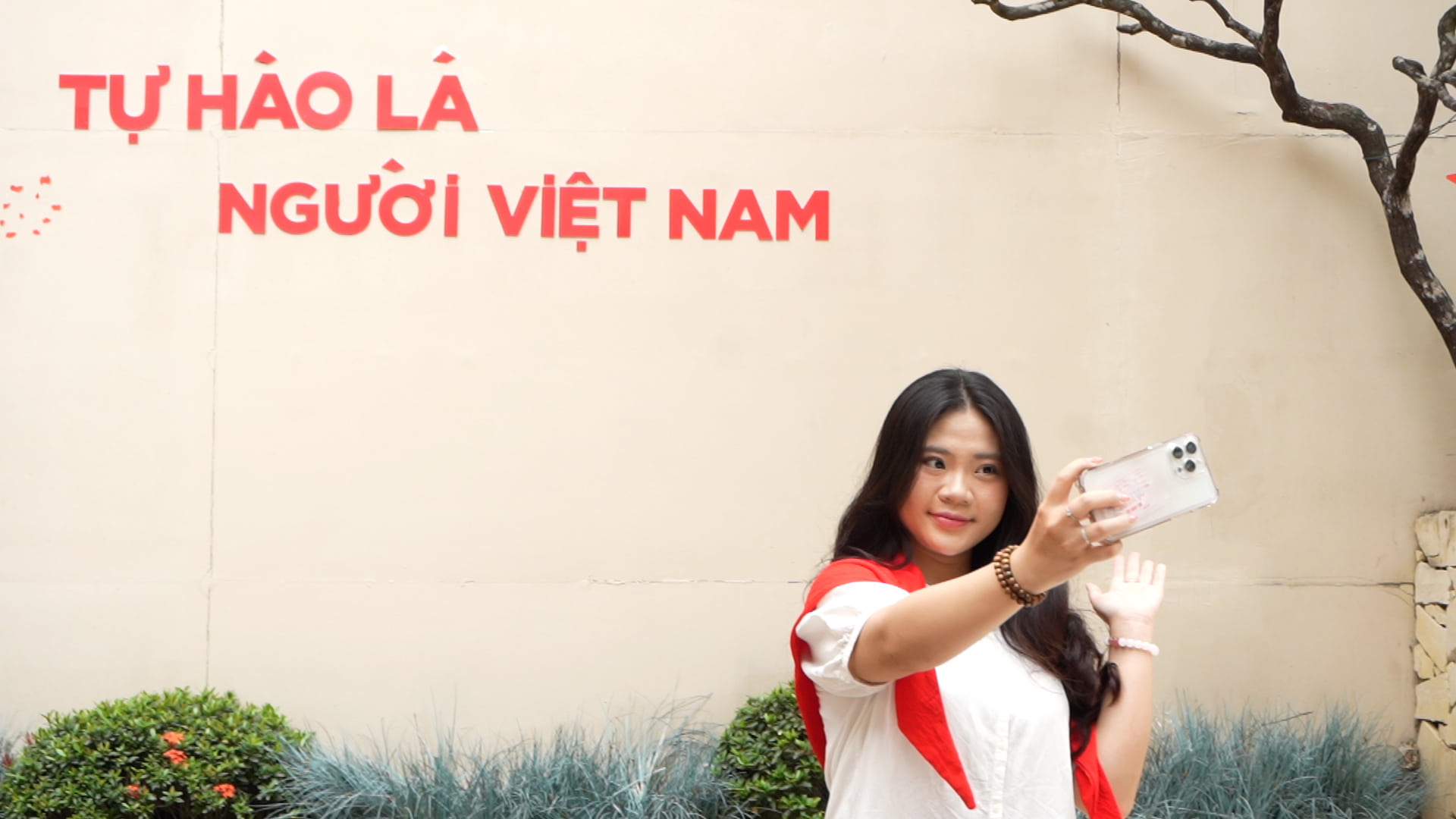 People check-in in a coffee space covered in the red color of the national flag on April 30th in Hanoi. Photo: Huyen Anh
