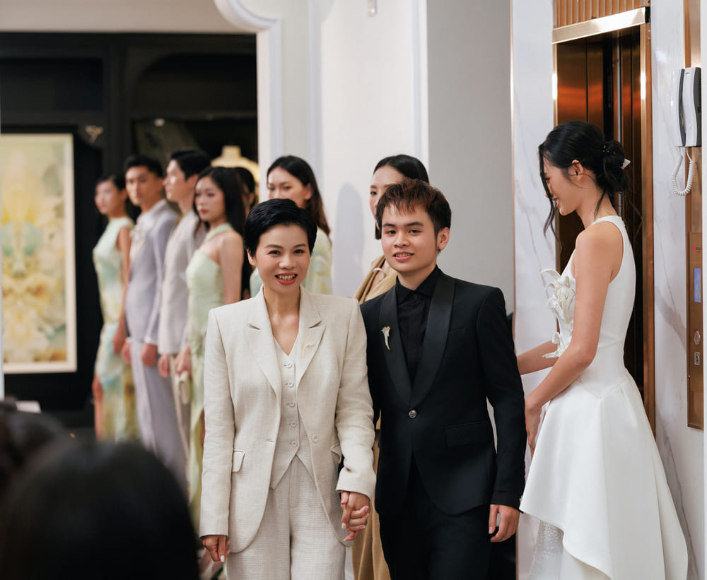Designer Xuan Le and his son - Creative Director Tri Le at the fashion show and exhibition "Silence'26". Photo: Team Truong Gia Huy