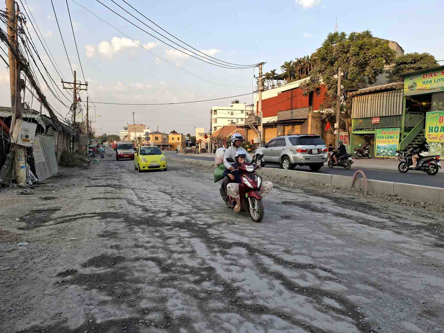 Damaged Hoang Huu Nam road surface affects people's travel. Photo: Minh Quan