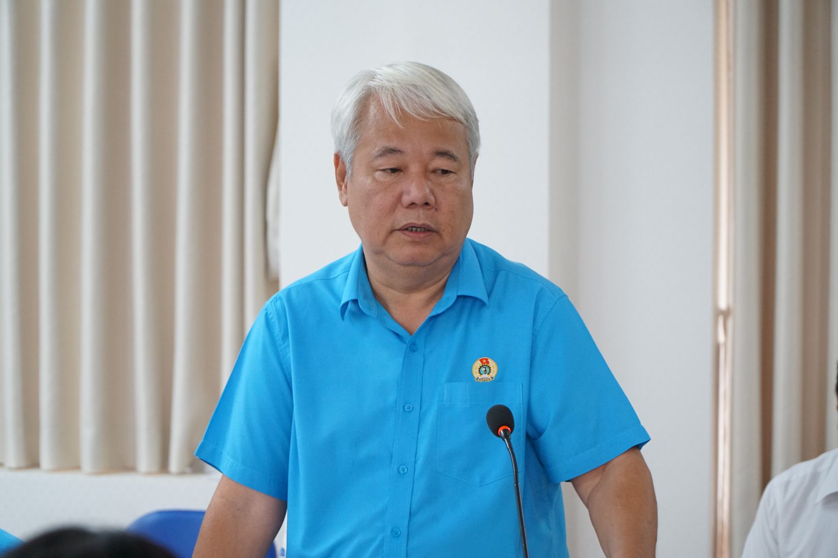 Ông Võ Khắc Thái - Phó Chủ tịch Thường trực Liên đoàn Lao động TPHCM báo cáo tại buổi làm việc. Ảnh: Thanh Chân