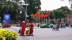 Hanoi is filled with the colors of flags and flowers, people excitedly wear ao dai to the streets before the April 30th holiday
