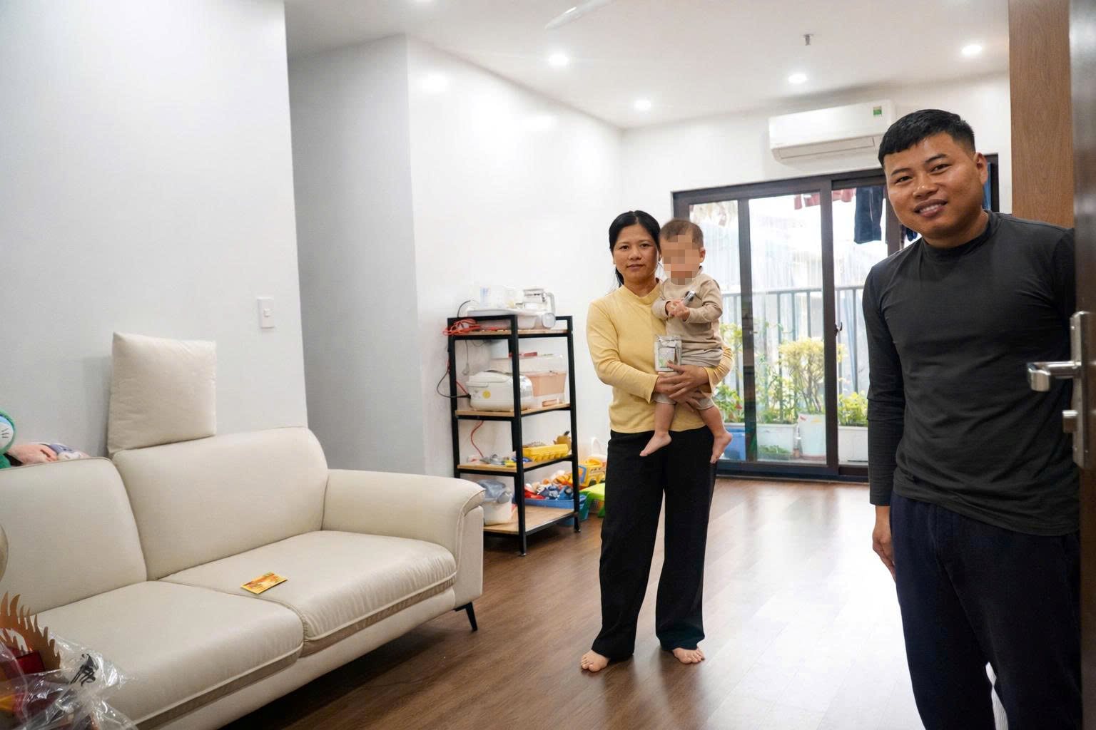 Mr. and Mrs. Mai Xuan Thang in their new social housing apartment. Photo: TRAN TUAN