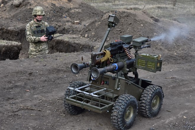 Ukrainian soldiers test unmanned ground vehicle (UGV). Photo: AFP
