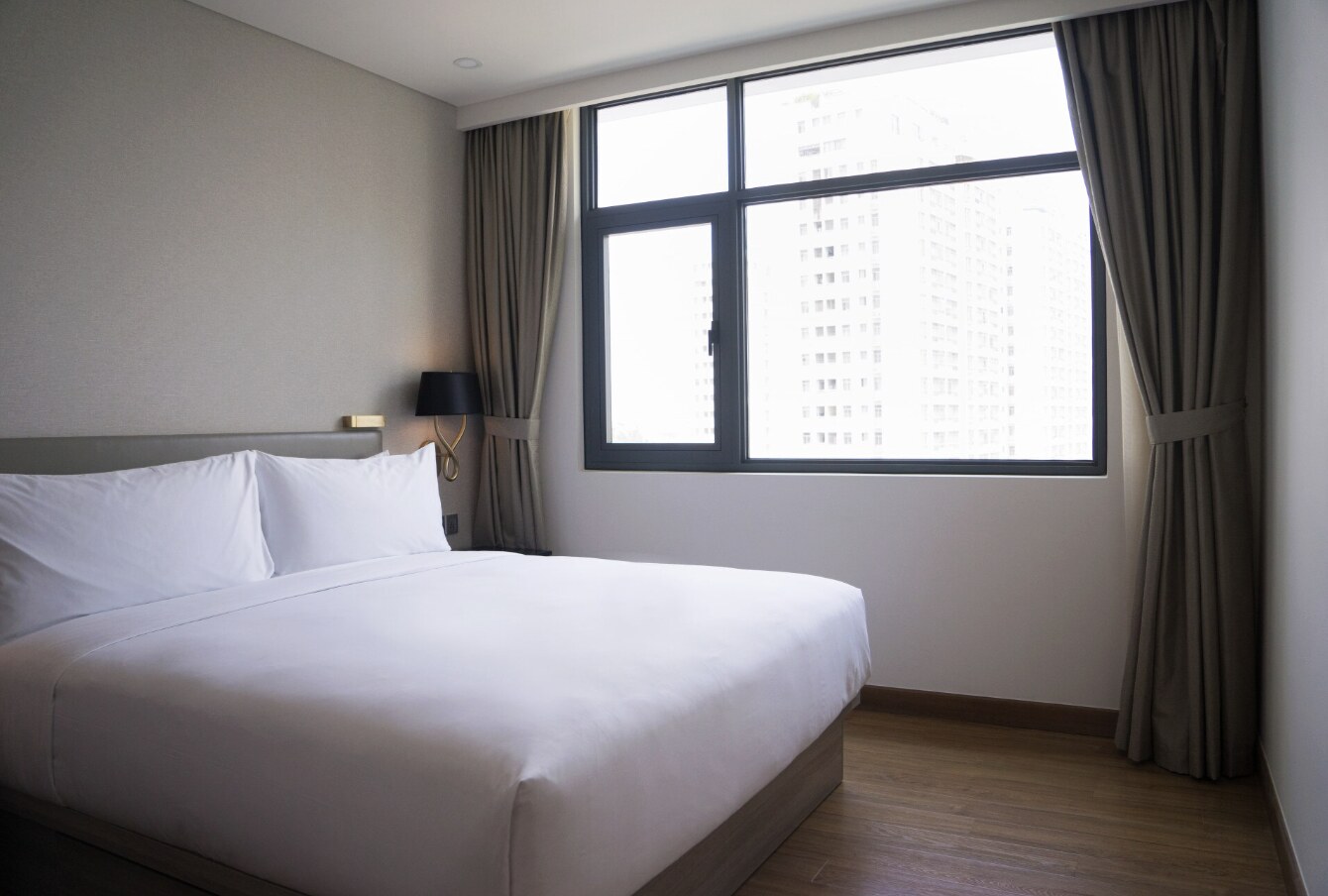 Placing a bed under a window seems airy but can affect sleep. Photo: Thuy Duong