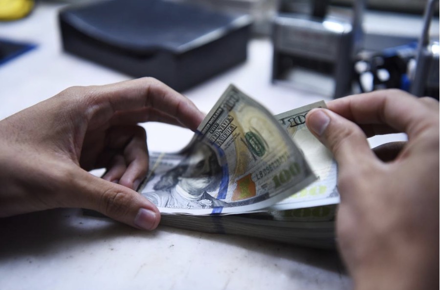 Làn sóng phi USD hóa có thể đẩy giá vàng lên 8.000 USD. Ảnh: Xinhua 