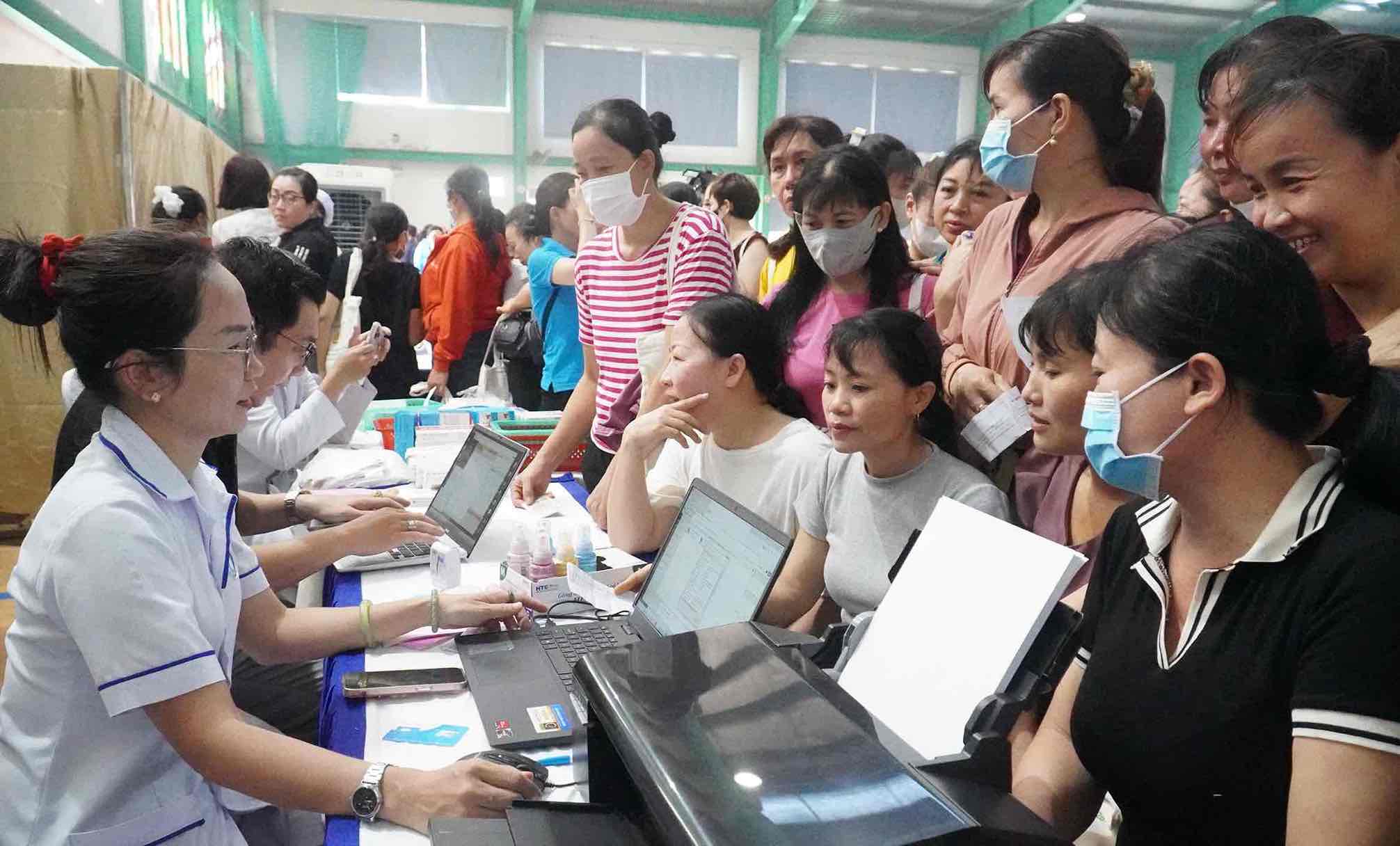 Workers register for health check-ups at the festival. Photo: HAC