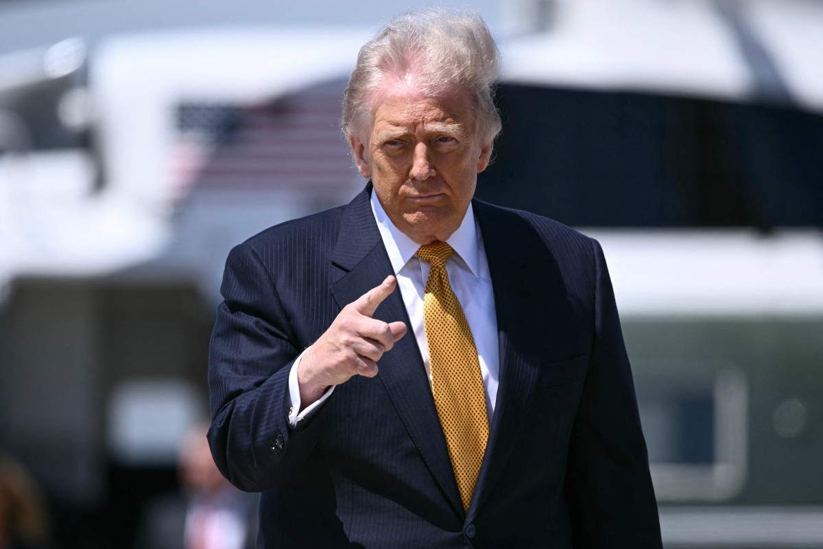 President Trump before boarding a plane to China on May 12. Photo: AFP