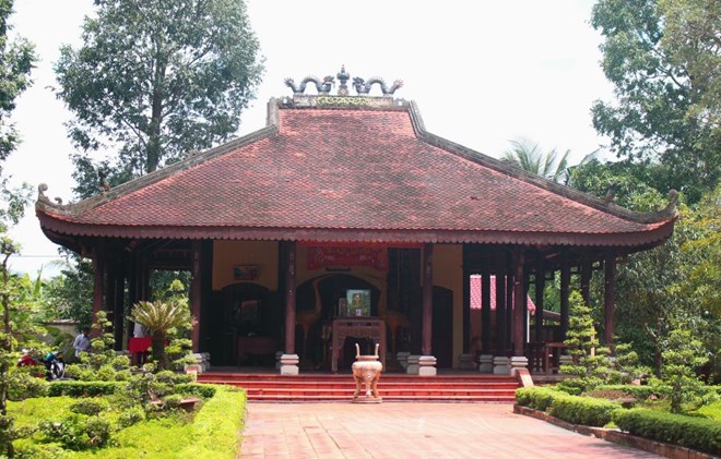 Long Hung communal house relic associated with the Southern Uprising in 1940 - the place marking the birth of the first red flag with a yellow star. Photo: Luc Tung