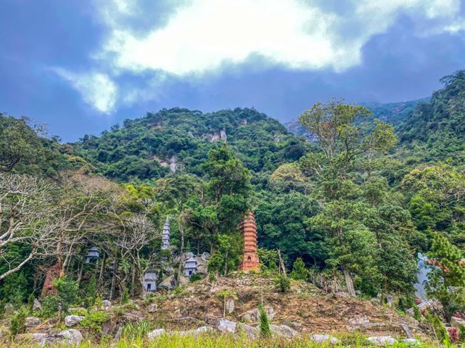Hidden under the mountains and forests are ancient towers at Ho Thien Pagoda. Photo: Tam Phuc