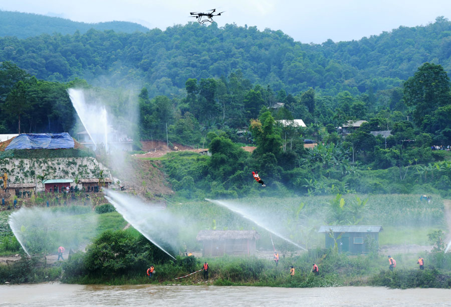 Using unmanned aerial vehicles (UAVs) to conduct rescue and relief drills. Photo: Tien Lap