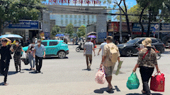 In the intense heat, cancer patients struggle to enter and exit the radiation therapy hospital.