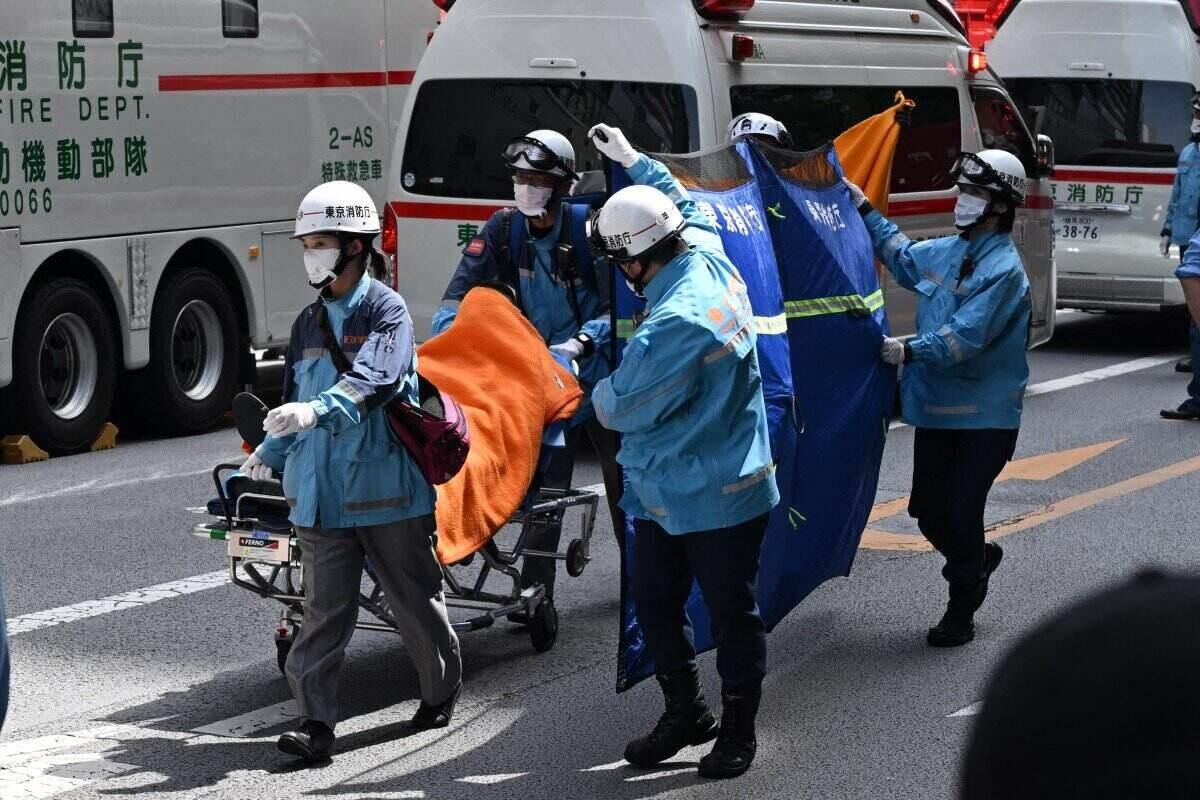 Rescue forces take victims of a suspected toxic gas spraying incident in Japan to the hospital. Photo: AFP