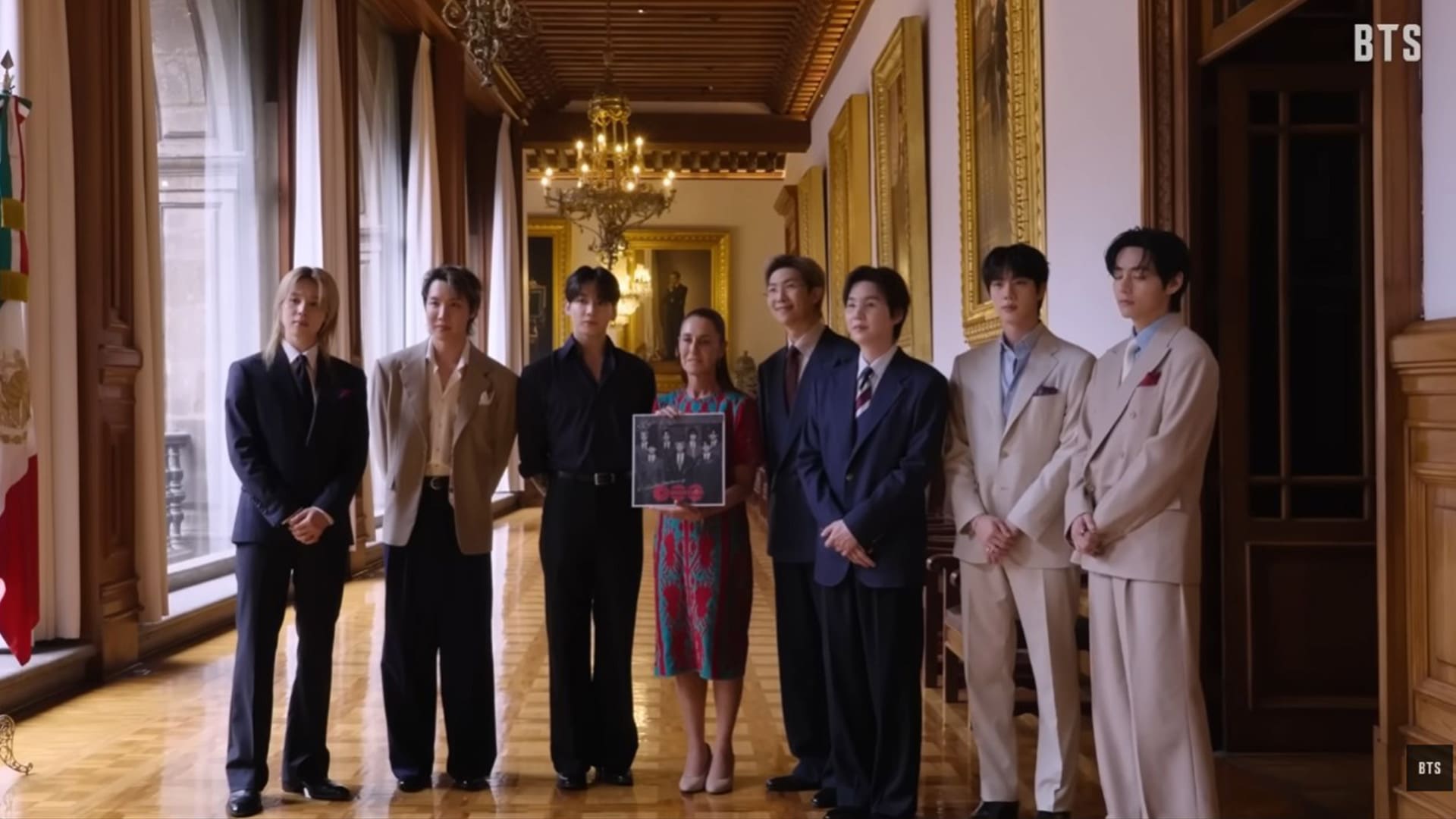 BTS and Mexican President Claudia Sheinbaum during a visit to the National Palace. Photo cut from video