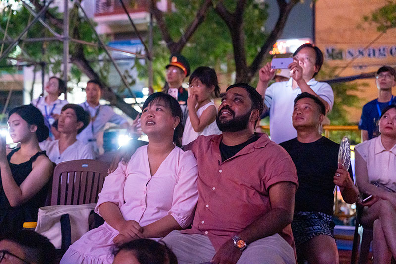 People and tourists look forward to the international fireworks opening night in Da Nang