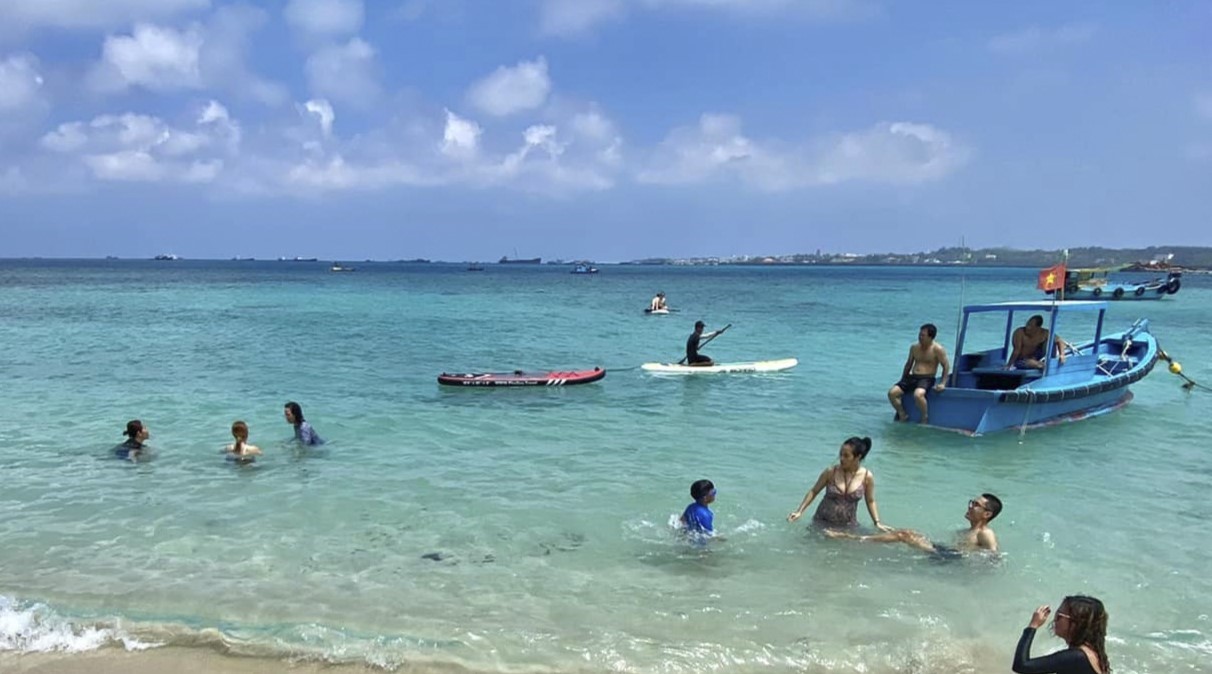 Phu Quy Island is bustling with tourists visiting during the calm sea season