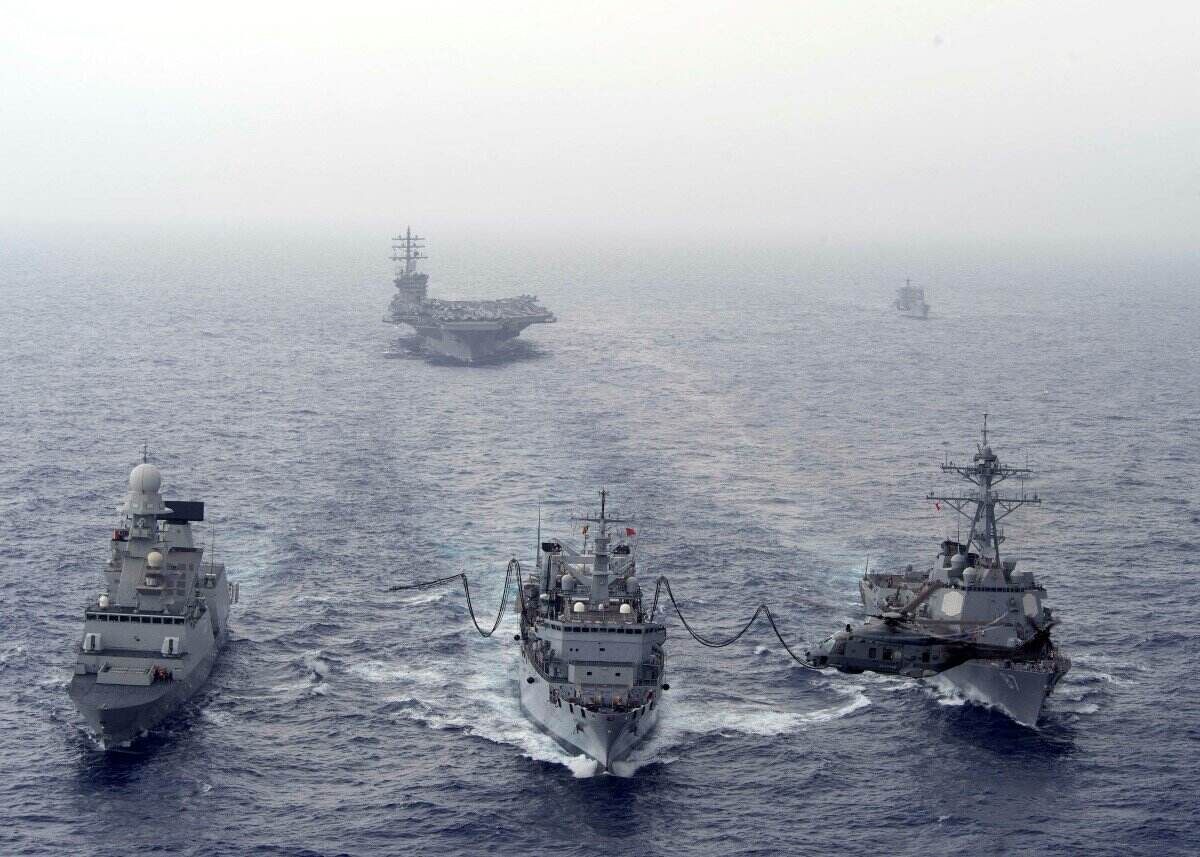 US Navy guided-missile destroyer USS Mason (right front) refueling at sea. Photo: AFP