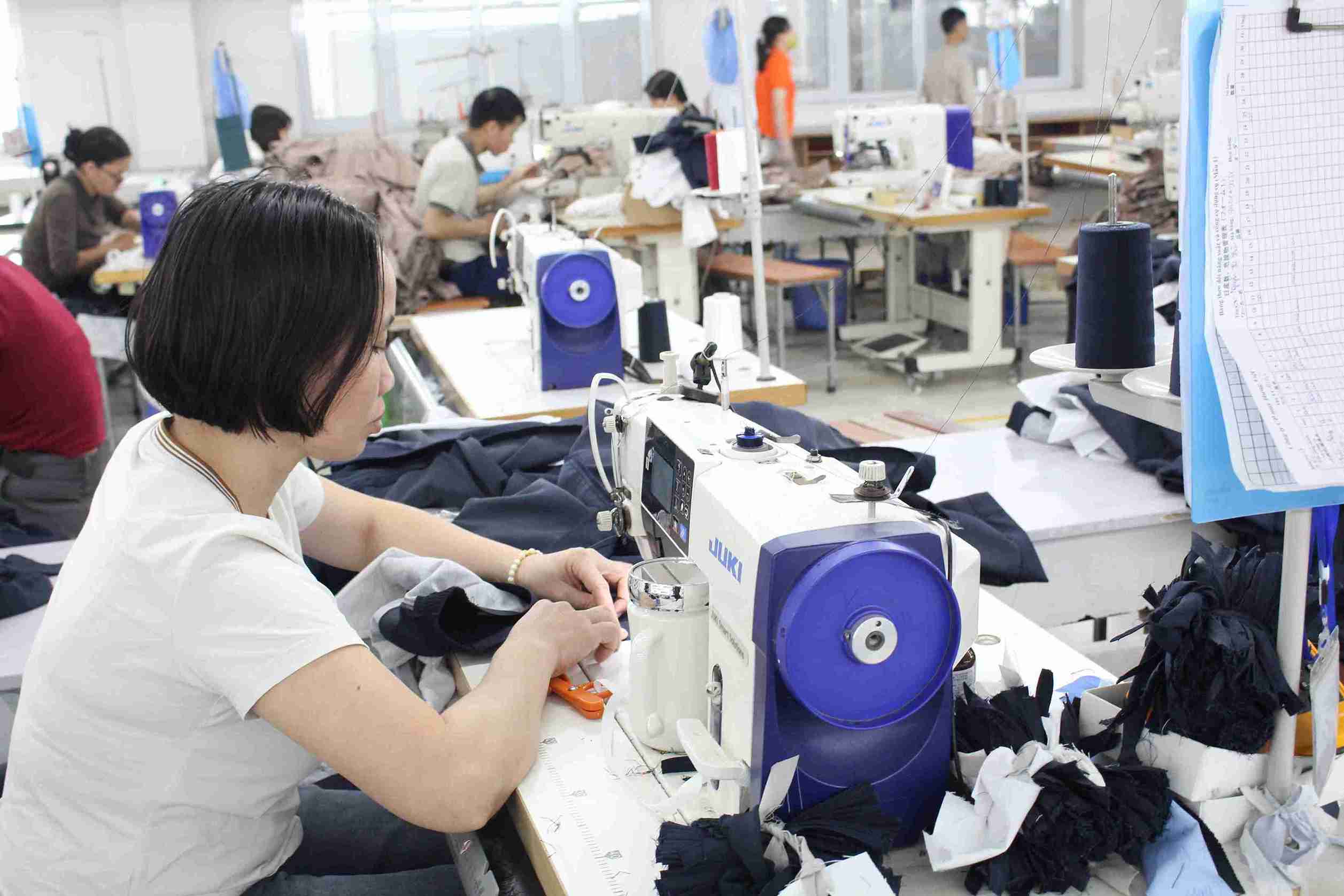 Workers concentrate highly during the working shift at the factory. Photo: Mai Huong