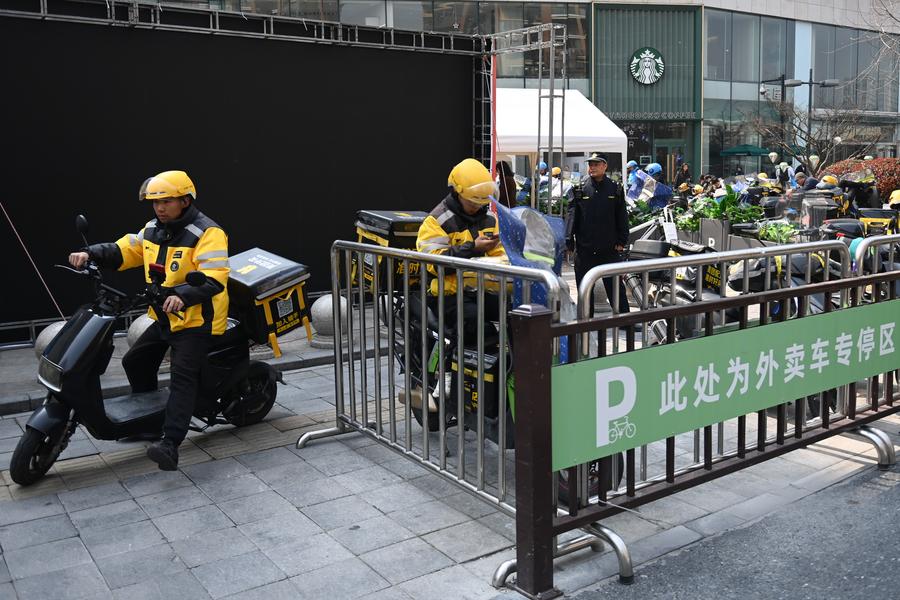 Online food delivery shippers in China. Photo: Xinhua