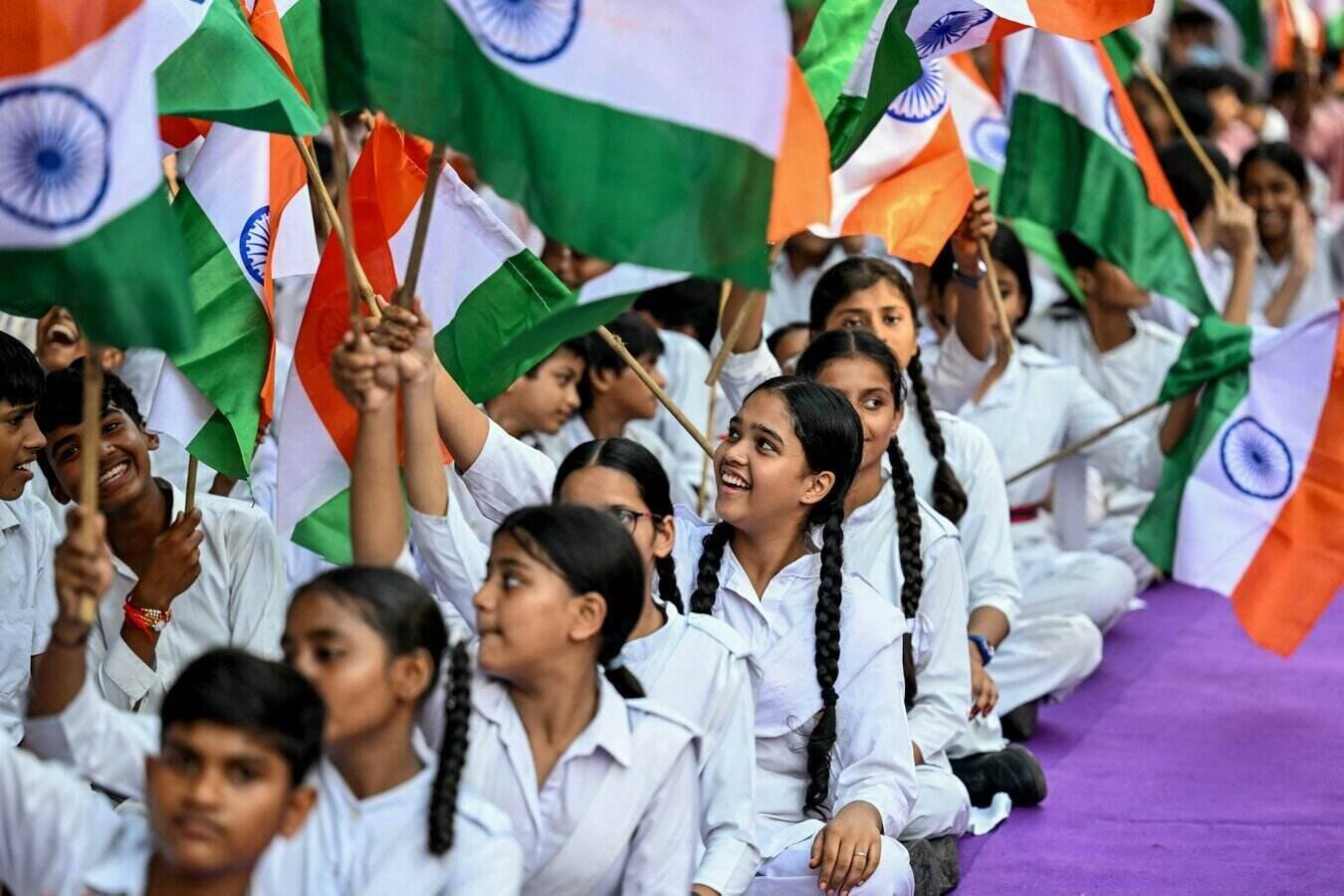 Students holding Indian flags at an event in New Delhi in August 2025. Photo: AFP