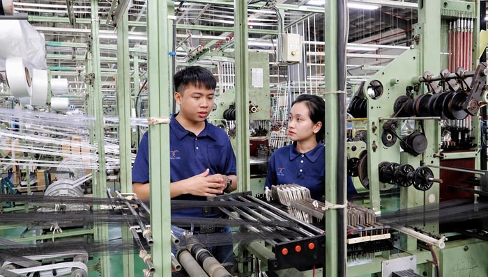 Pictured is the weaving machine improvement initiative of workers of Da Nang Telala Co., Ltd. helping to save 10% of raw materials and bring in hundreds of millions of VND in revenue each month. Photo: Tran Thi